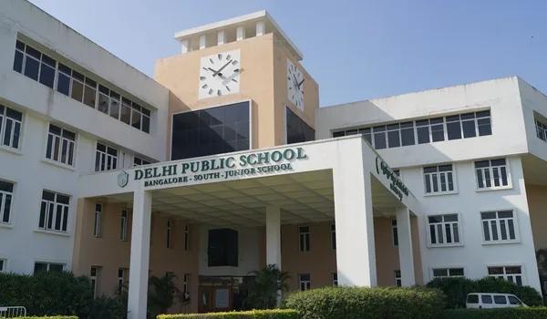 Delhi Public School Bengaluru South Delhi Public School Bangalore South, Bangalore — junior school building with its clock tower and the school name board over the entrance colonnade