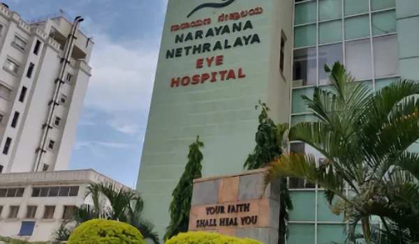 Narayana Nethralaya — an eye hospital Narayana Nethralaya Eye Hospital, Bangalore — green-clad hospital tower with the Narayana Nethralaya Eye Hospital lettering in Kannada and English on its facade